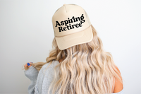 Aspiring Retiree DTF Printed Khaki BlackWriting Trucker Hat