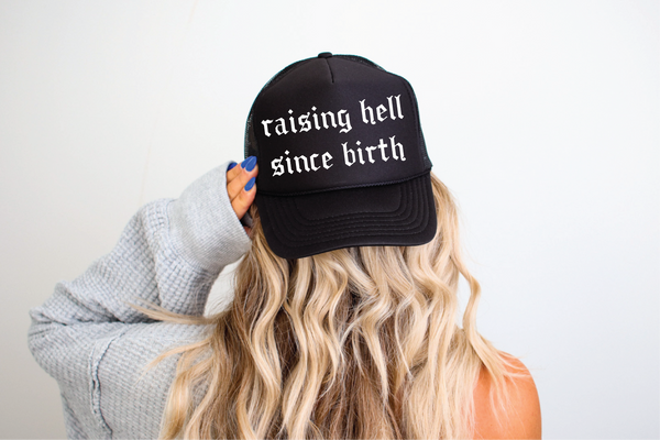 Raising Hell Since Birth DTF Printed Black Trucker Hat